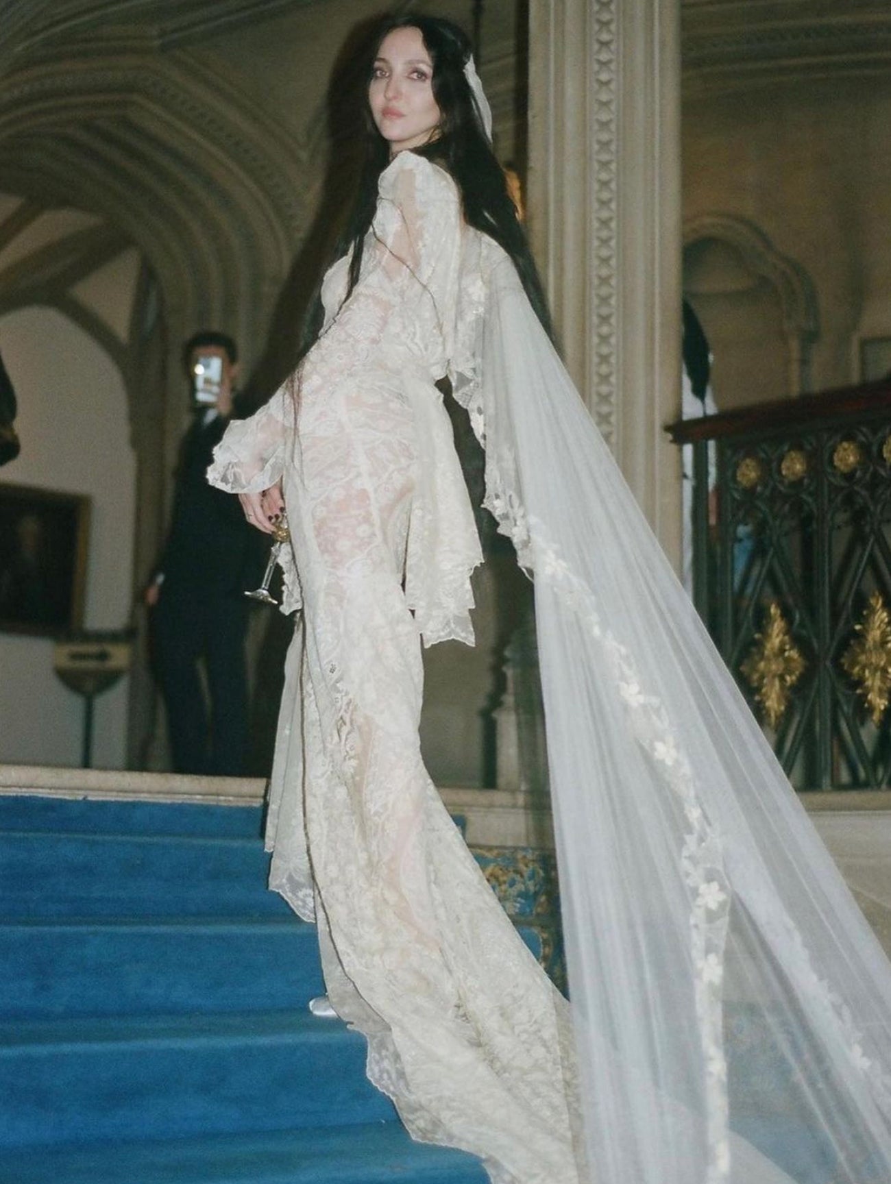 Tish Weinstock wearing an antique lace gown and ’30s-inspired veil by Jane Bourvis